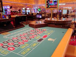 Antarmuka permainan Nolimit City di platform abgerny dengan meja dealer live dan slot modern